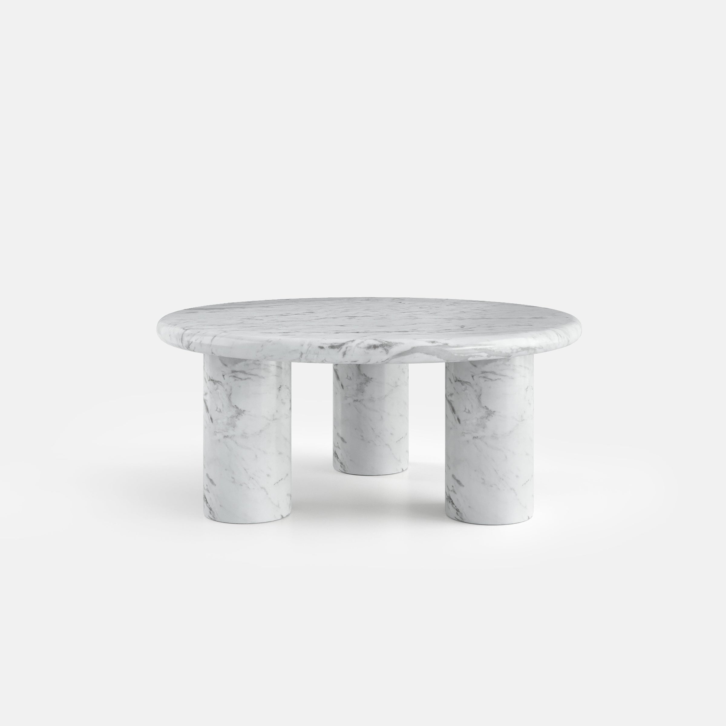 Table basse ronde en pierre naturelle dans une composition épurée